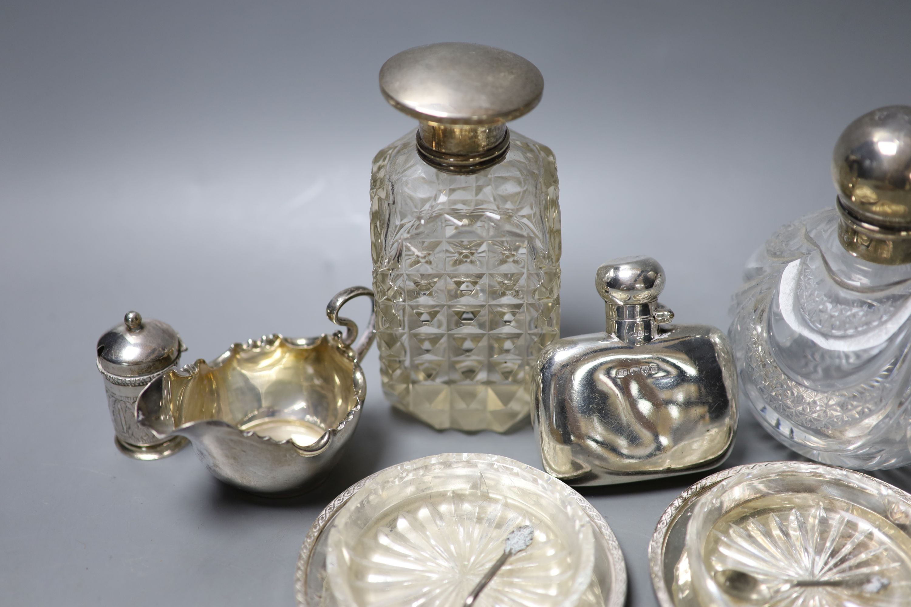 Mixed small silver including pair of silver dishes with glass liners, a silver hip flask, silver cream jug, scent bottles etc.